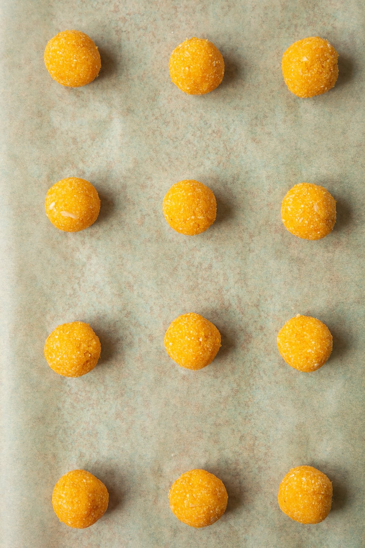 12 balls made from blended, apricots and nuts. 
