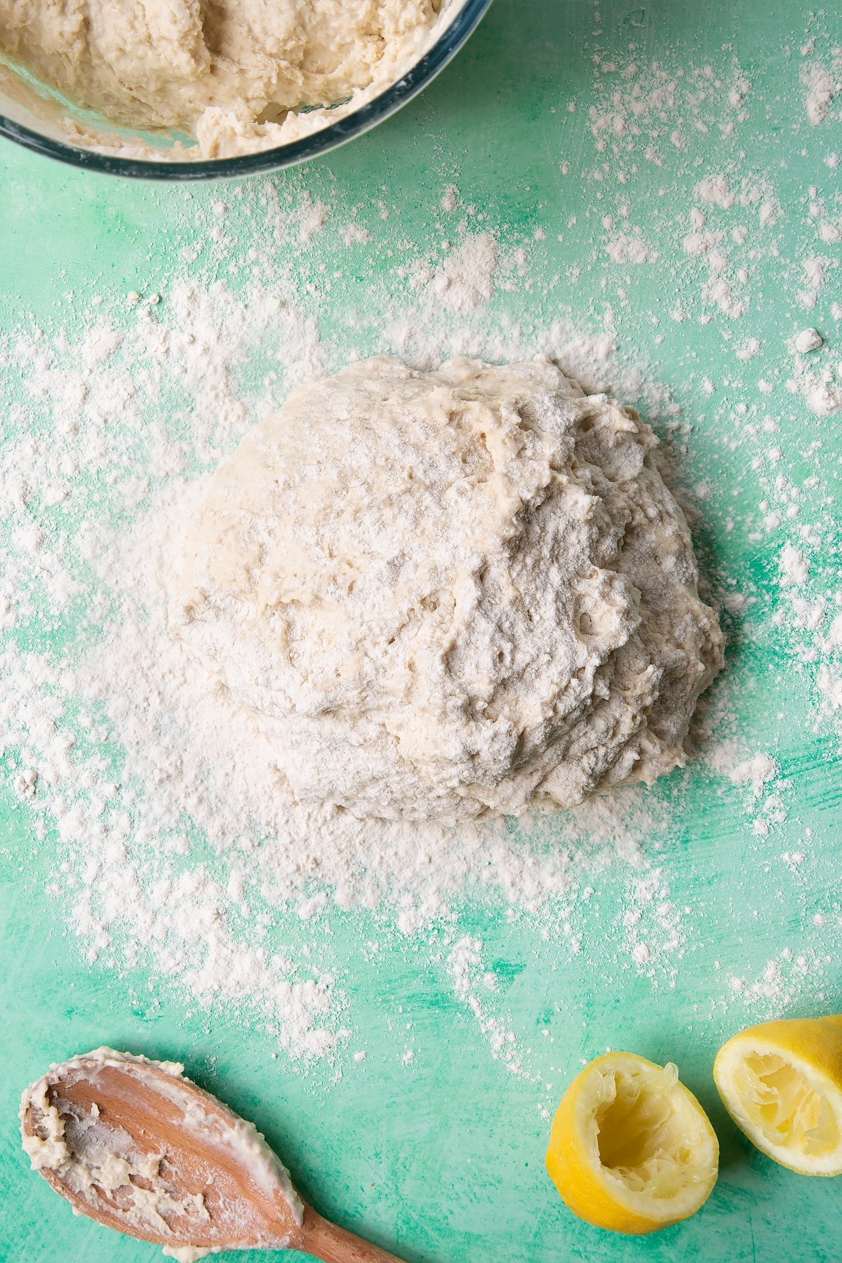Dough to make a soda bread recipe without buttermilk tipped onto a floured surface and sprinkled with flour.