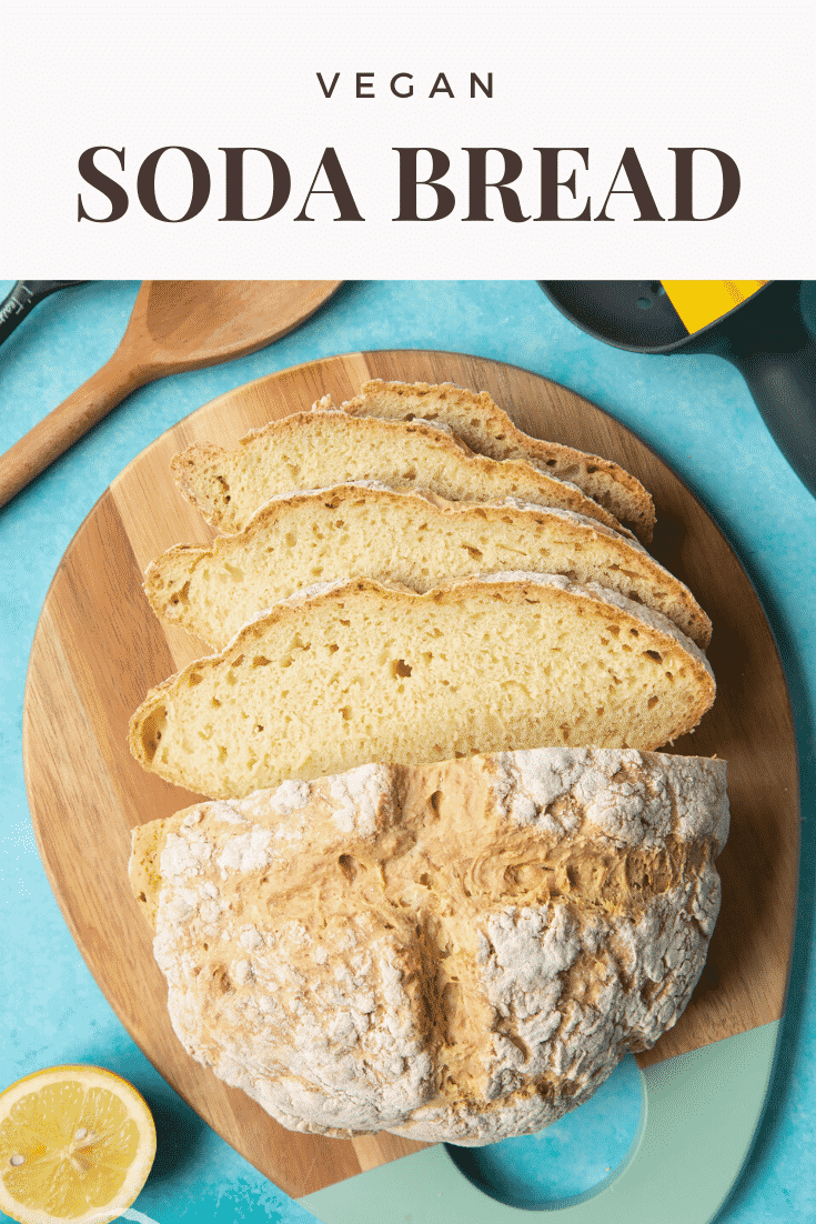 Vegan soda bread sliced on a board. Caption reads: vegan soda bread.