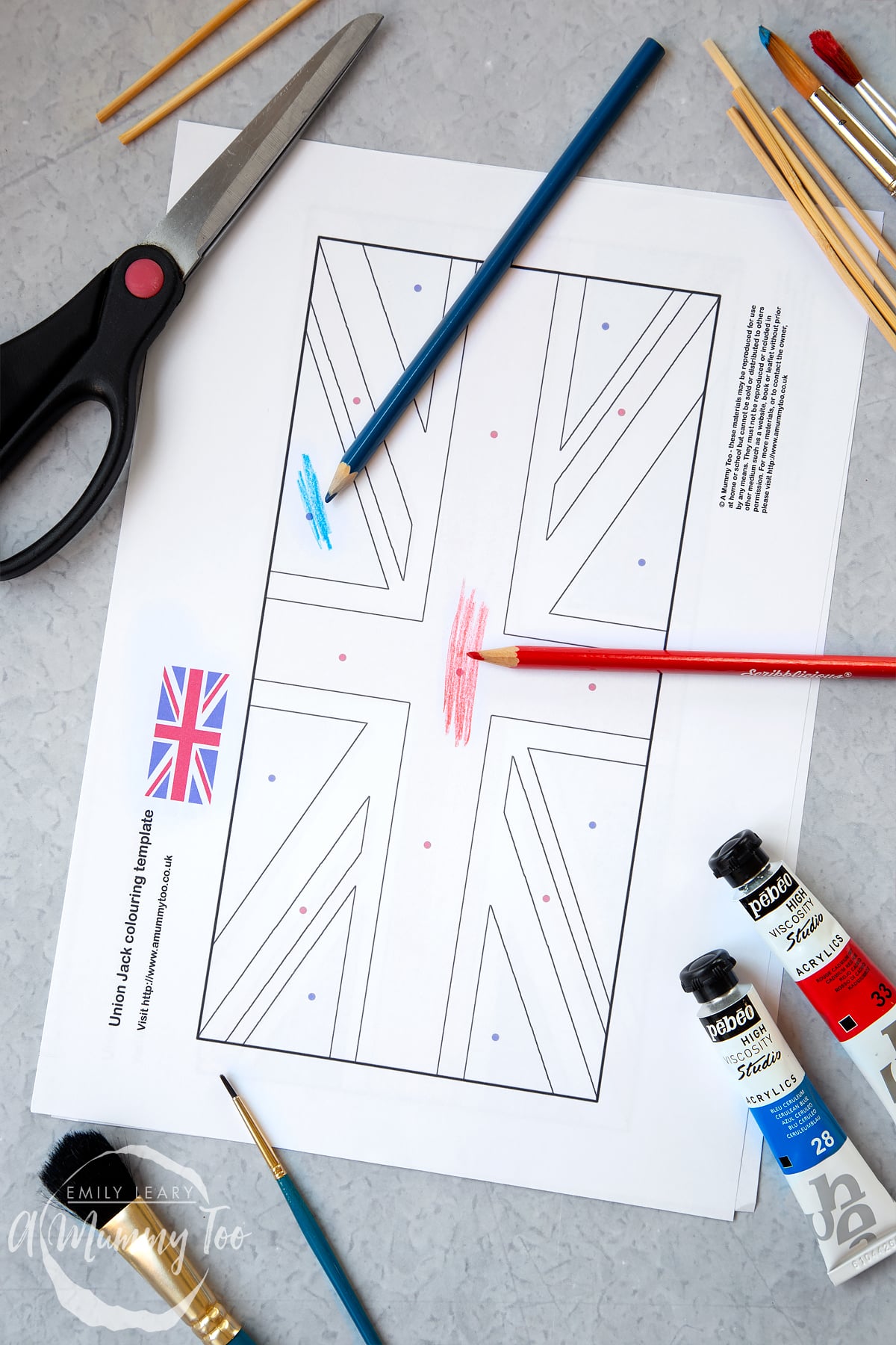 printed Union jack print out with dots to show where the colours are meant to go and colours colouring in the flag.