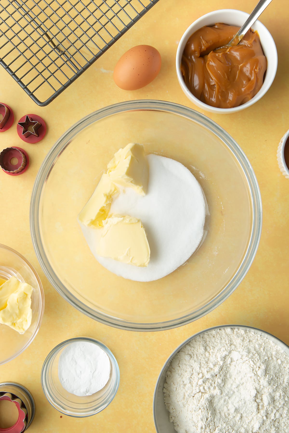 Overhead shot of butter and sugar in a large mixing bowl