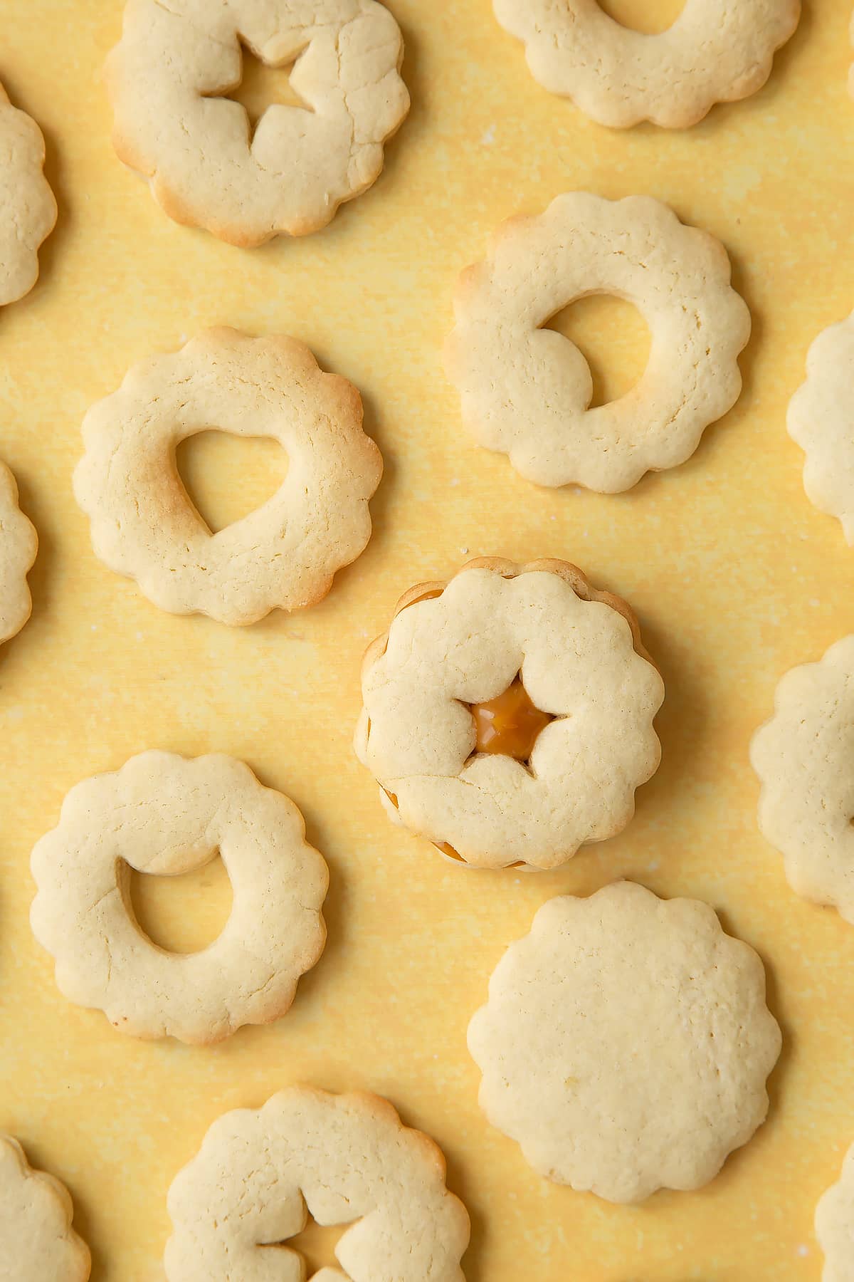 Adding the top of the biscuits ontop of the caramel. 