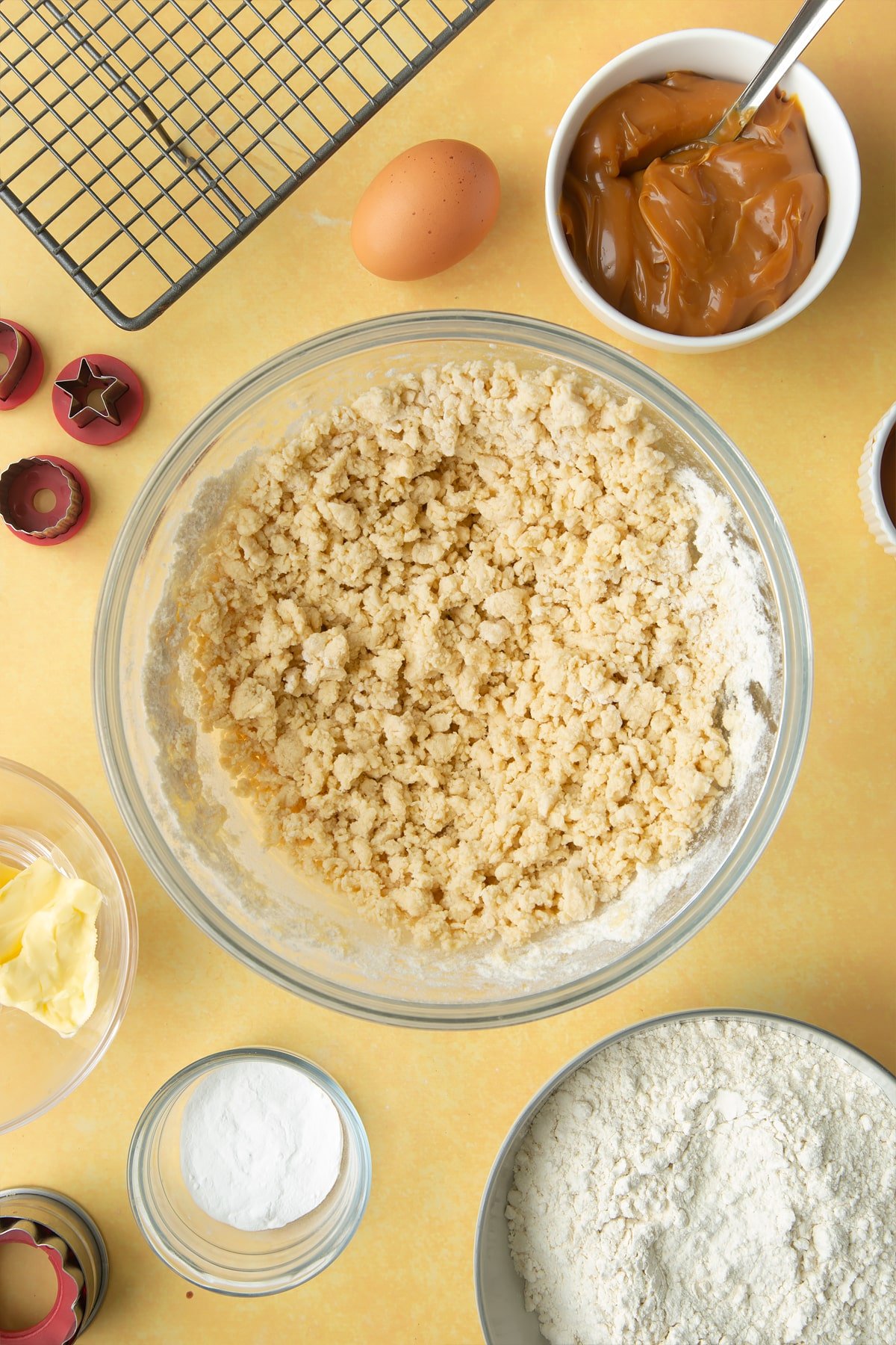 Overhead shot of dough in a large clear bowl