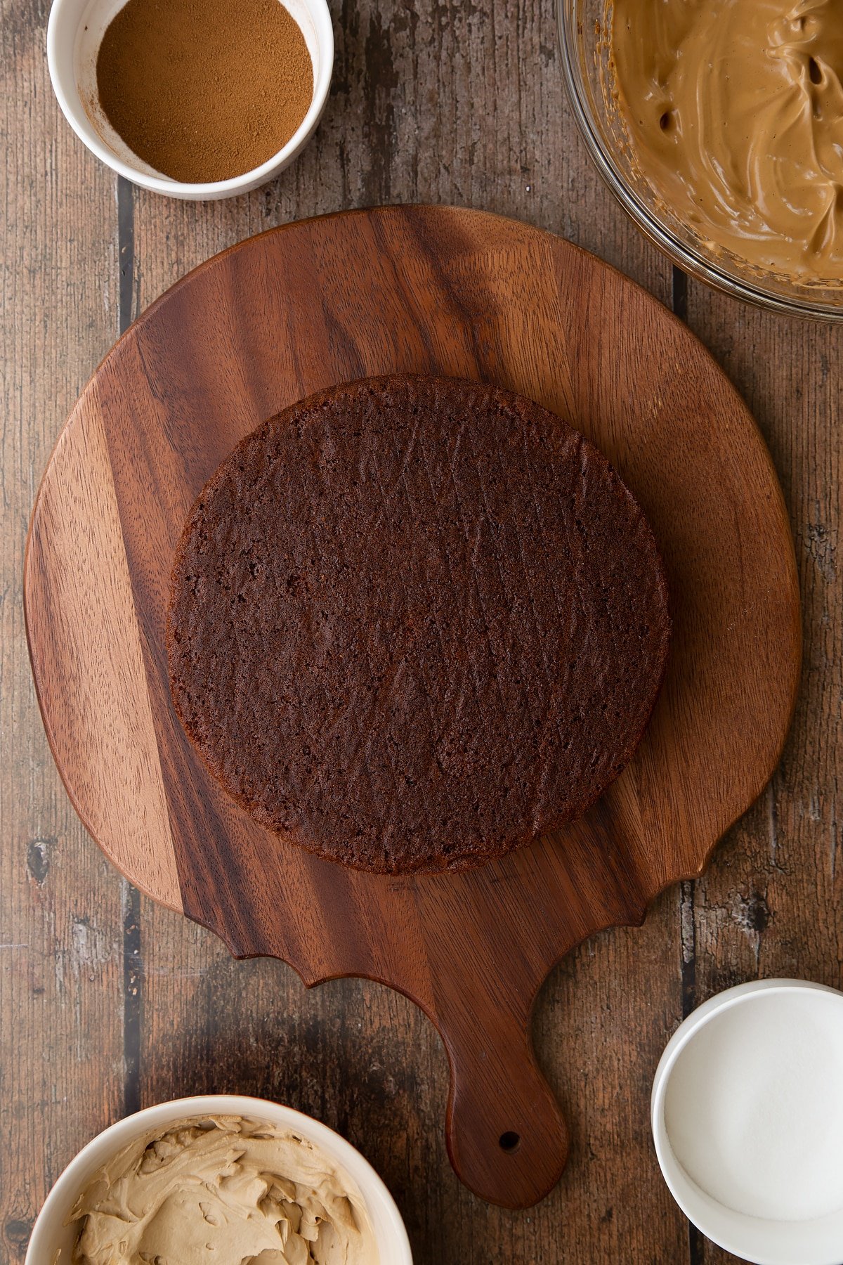 Dalgona coffee cake sponge on a wooden board.