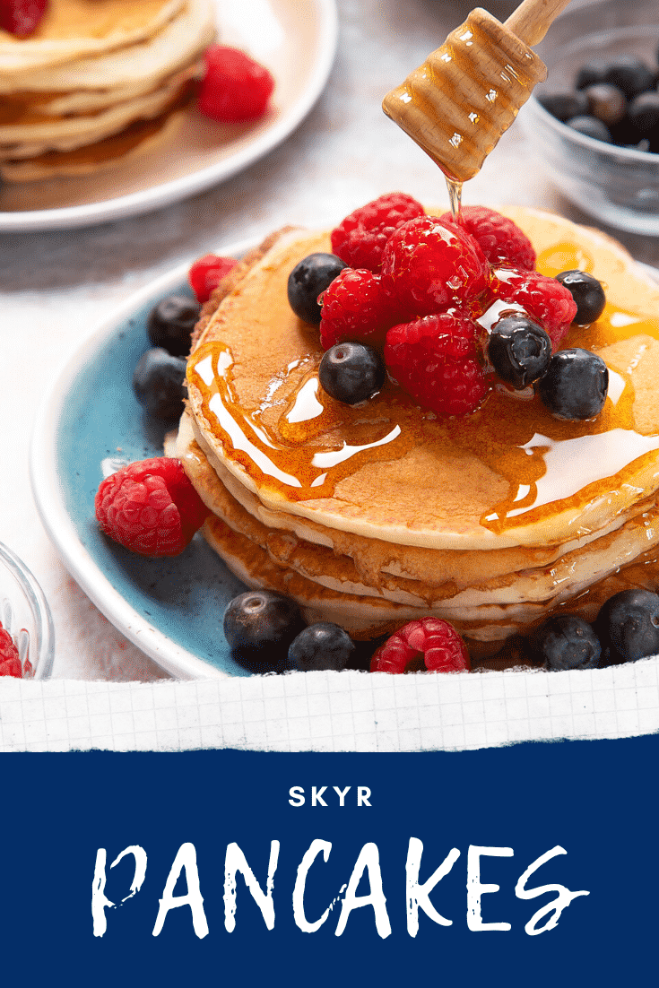 Skyr pancakes served with berries and honey. Caption reads: skyr pancakes