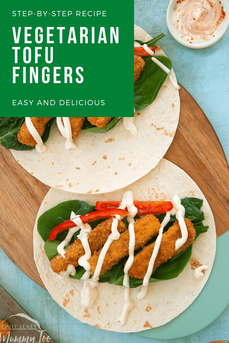 Flour tortillas filled with tofu fish sticks, salad and mayo on a wooden board. Caption reads: step-by-step recipe vegetarian tofu fish sticks easy and delicious