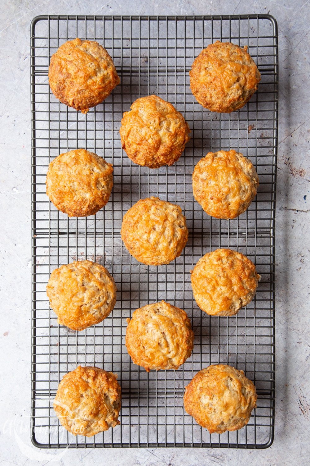 Easy cheese muffins cooling on a wire rack. 