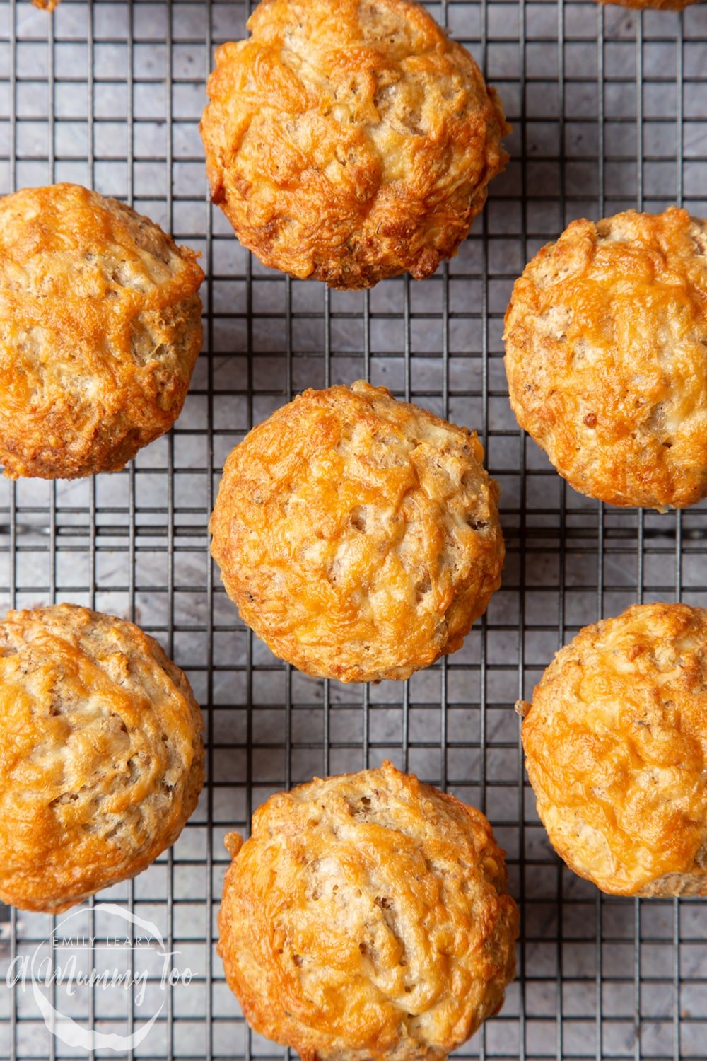 Close up of easy cheese muffins cooling on a wire rack. 