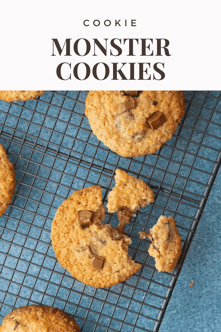 A broken cookie monster cookie on a wire rack. Caption reads: Cookie monster cookies