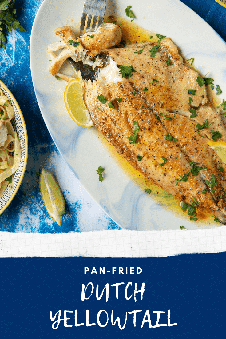 Pan-fried Yellowtail on a large oval serving dish. A fork delves into the buttery fish. Caption reads: pan-fried Dutch Yellowtail