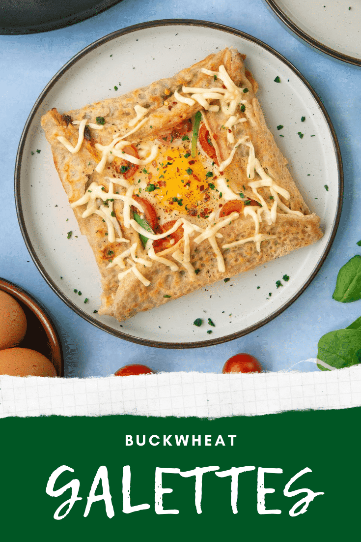 A view from above of a buckwheat filled with spinach, tomatoes, cheese and a lightly cooked egg. Caption reads: buckwheat galettes