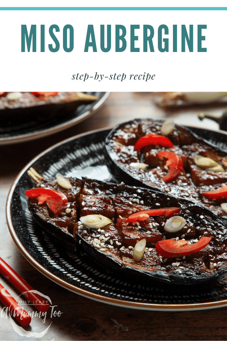 Two slices of miso aubergine on a plate, topped with chilli, springs onions and sesame seeds. Caption reads: miso aubergine step-by-step recipe