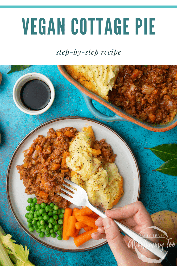 Vegan cottage pie served on a plate with peas and carrots. A hand with a fork takes some. Caption reads: vegan cottage pie step-by-step recipe