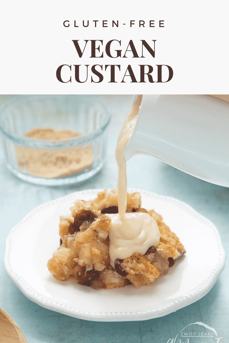 A berry crumble on a white plate covered with vegan custard being poured from a white jug. Caption reads: gluten-free vegan custard