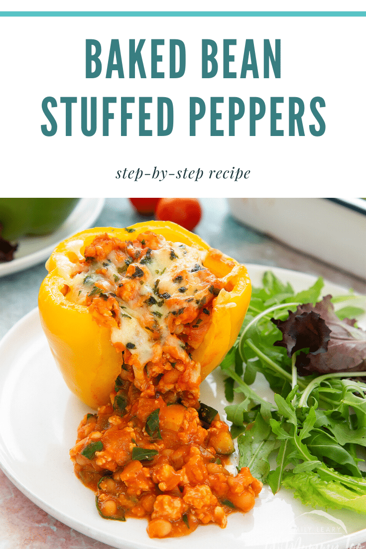 A yellow stuffed peppers served on a white plate. The filling spills out. Caption reads: Baked bean stuffed peppers step-by-step recipe