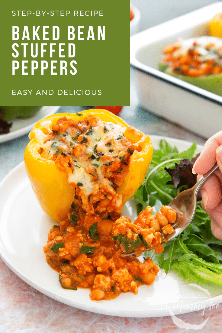 A yellow stuffed peppers served on a white plate. The filling spills out as a fork delves in. Caption reads: Step-by-step recipe baked bean stuffed peppers easy and delicious