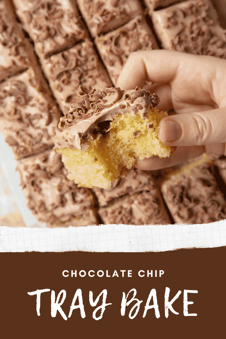 Hand holding a piece of chocolate chip tray bake with a bite taken out of it. Caption reads: chocolate chip tray bake