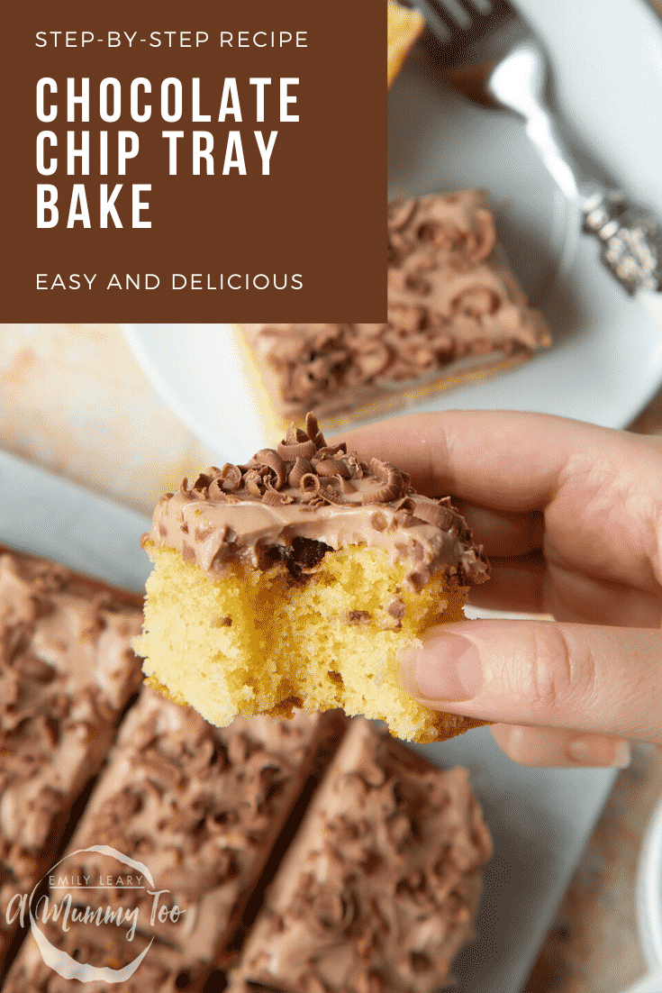 Hand holding a piece of chocolate chip tray bake with a bit out of it. Caption reads: step-by-step recipe chocolate chip tray bake easy and delicious