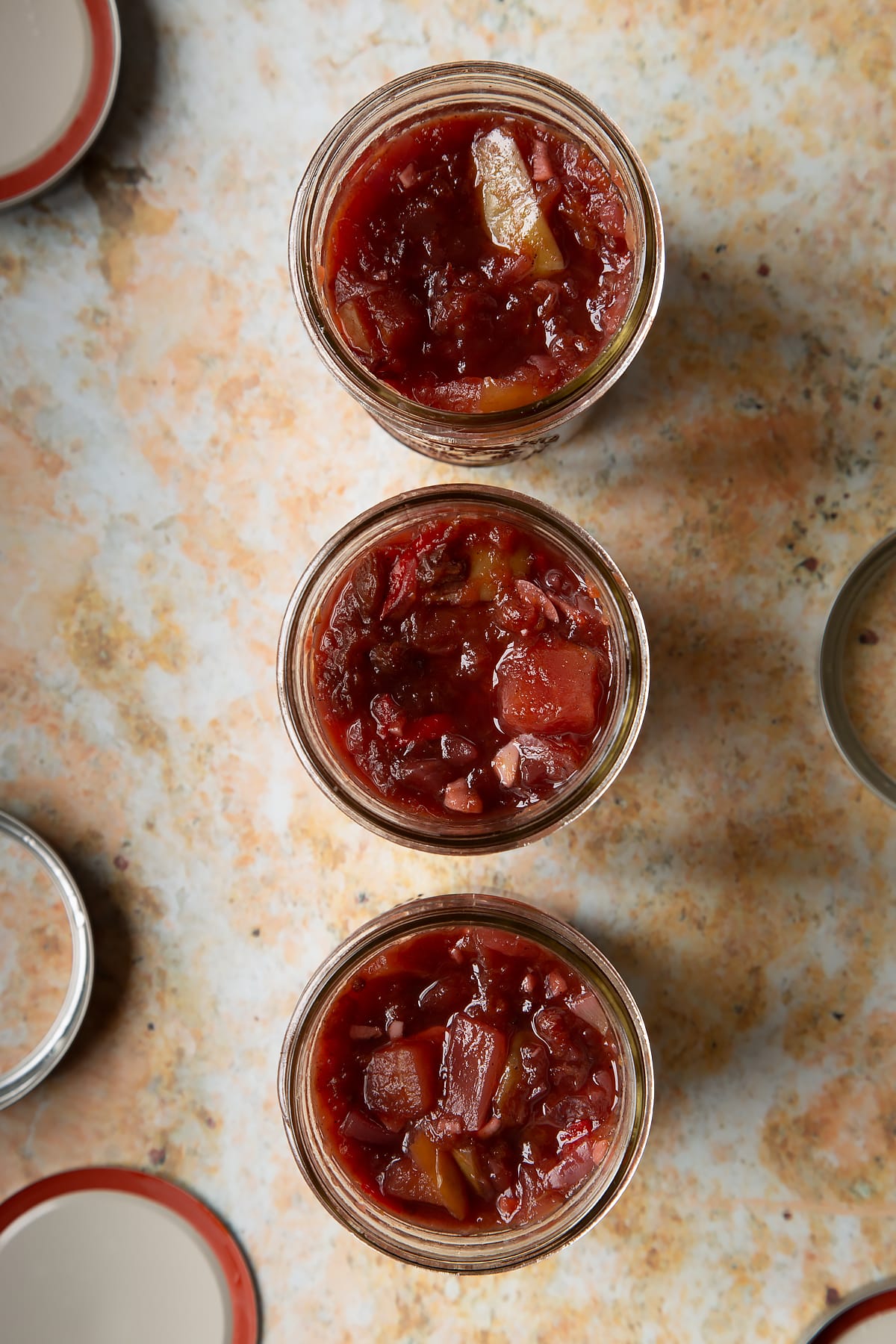 Fruit chutney recipe in three jars.