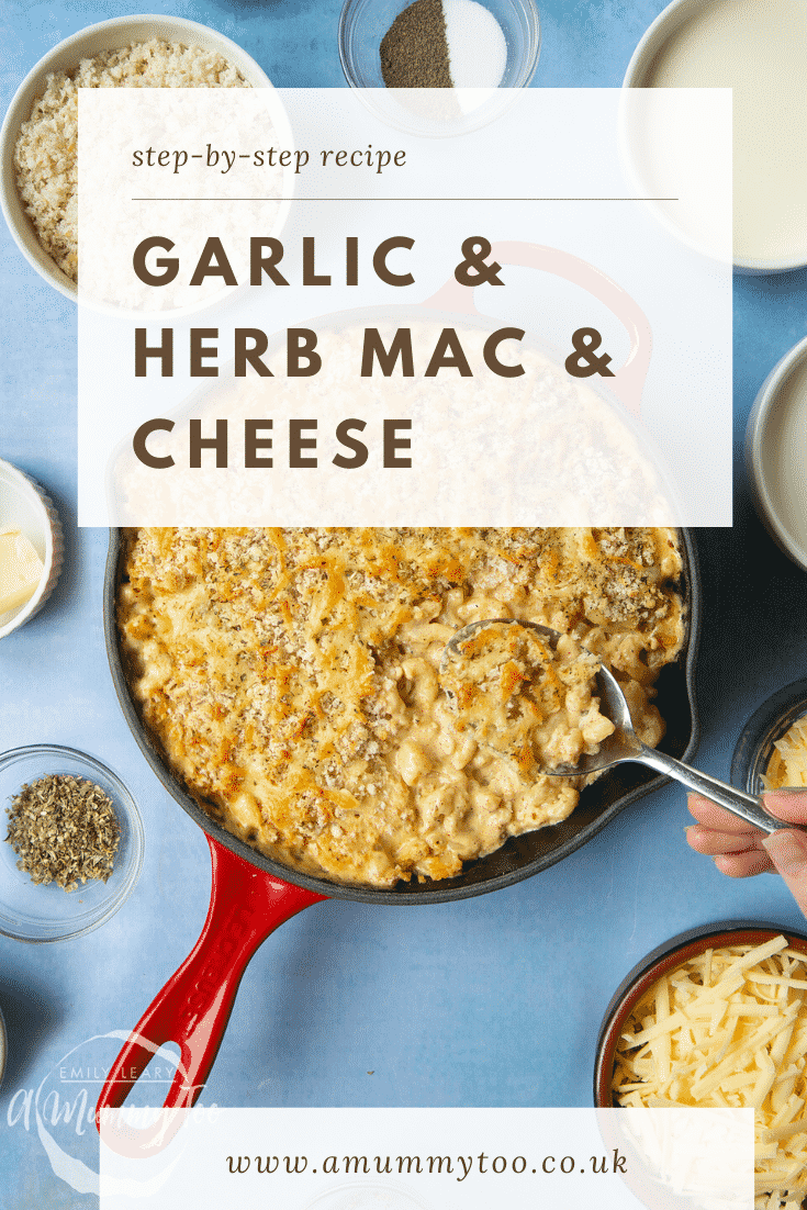 A red skillet with garlic and herb mac and cheese and a spoon delving into it. Caption reads: step-by-step recipe garlic & herb mac & cheese