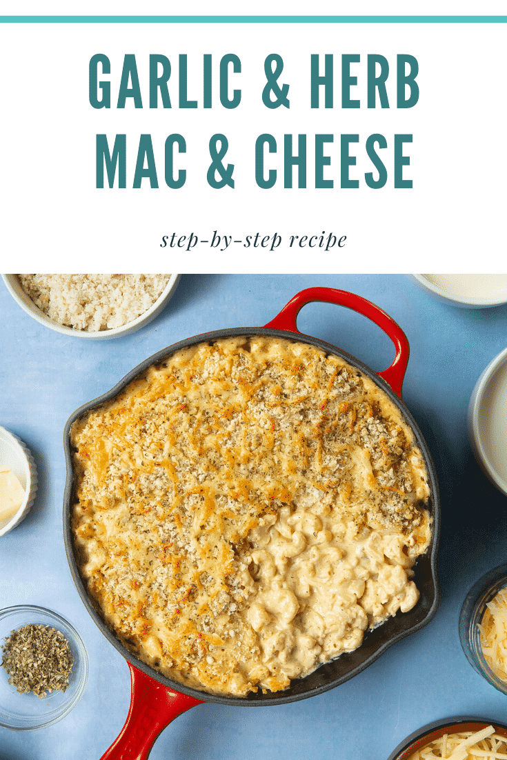A red skillet with garlic and herb mac and cheese. Caption reads: garlic & herb mac & cheese step-by-step recipe