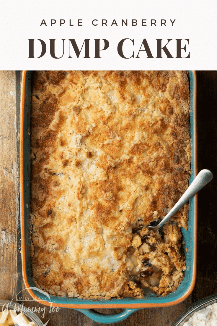 Apple cranberry dump cake in a tray. A spoon delves into it. Caption reads: apple cranberry dump cake