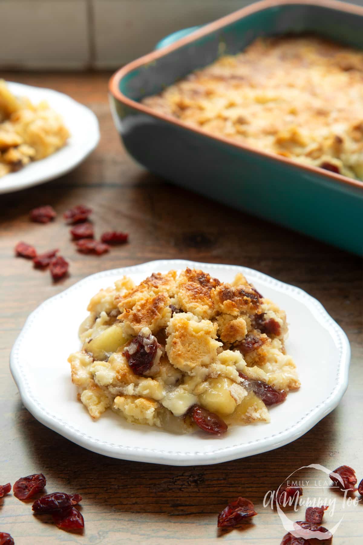 Apple cranberry dump cake served onto a small white plate. 