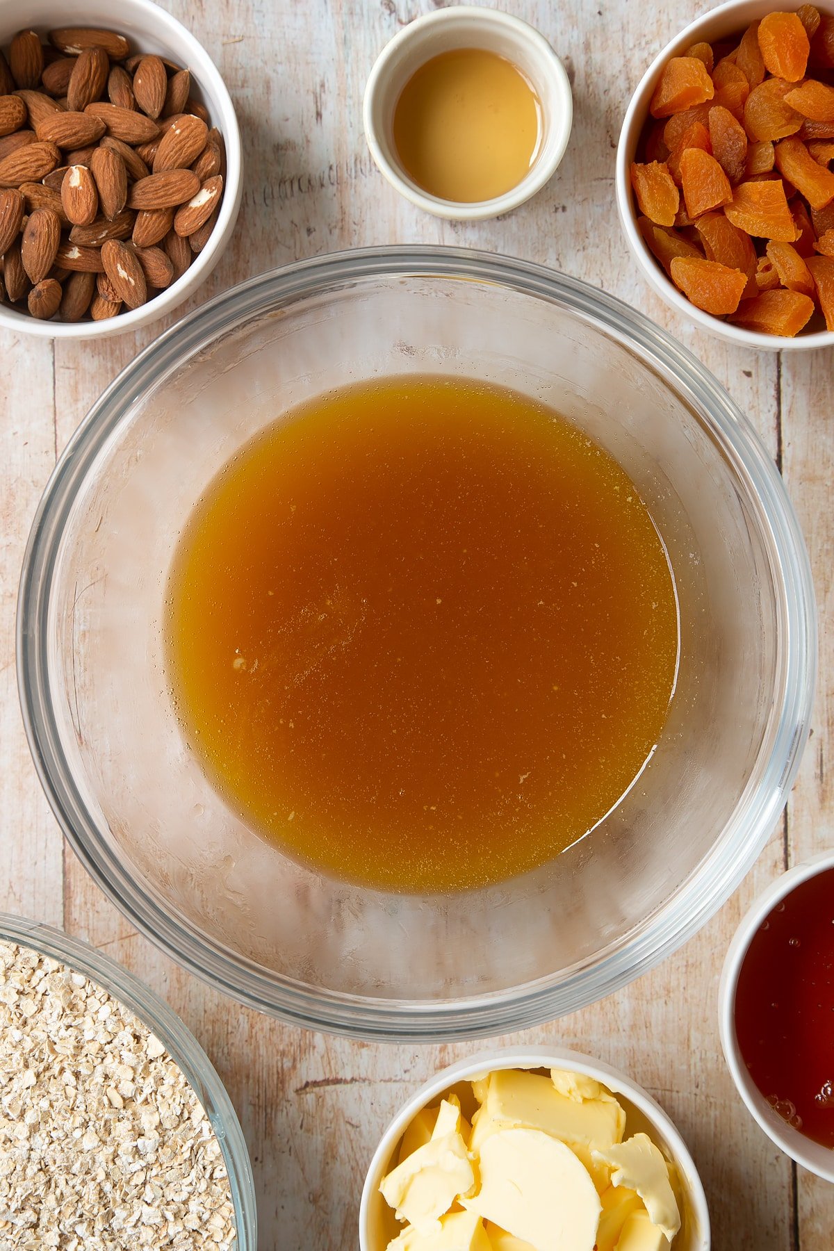 Overhead shot of liquid mixture in a large clear bowl