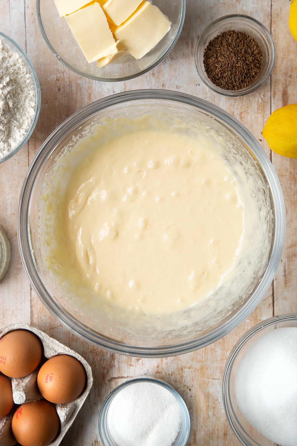 Overhead shot of butter and egg mix in a clear bowl