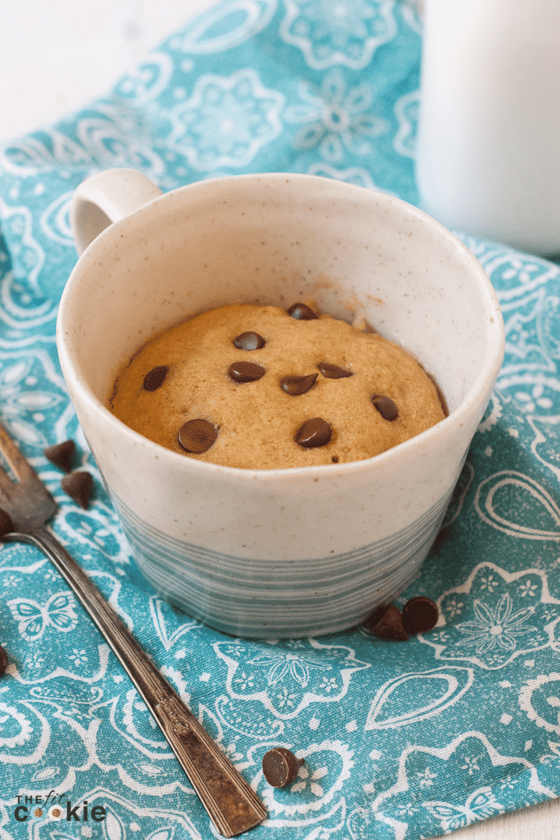 Gluten-free chocolate chip mug cake topped with chocolate chips.