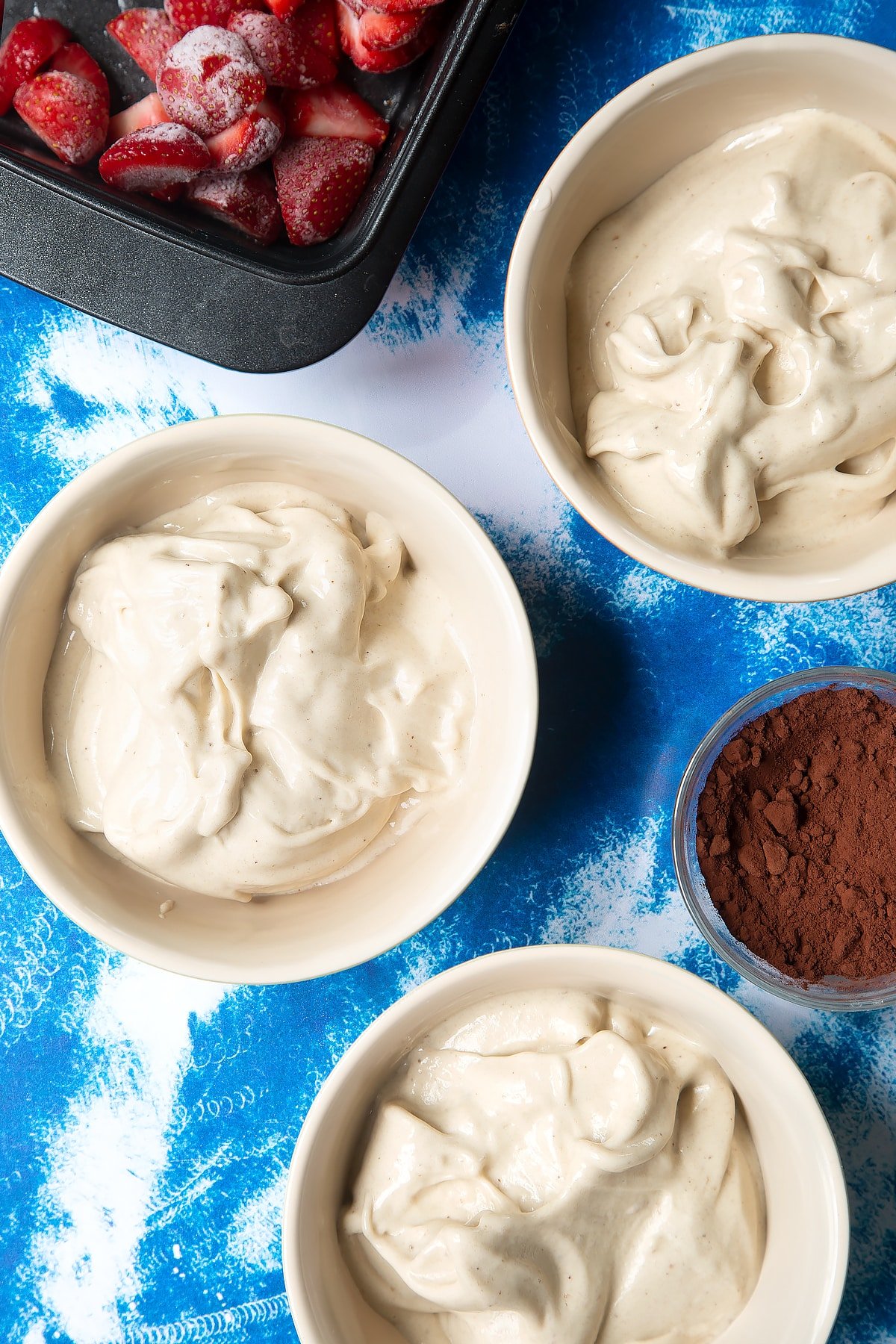 Pureed frozen bananas in three bowls.