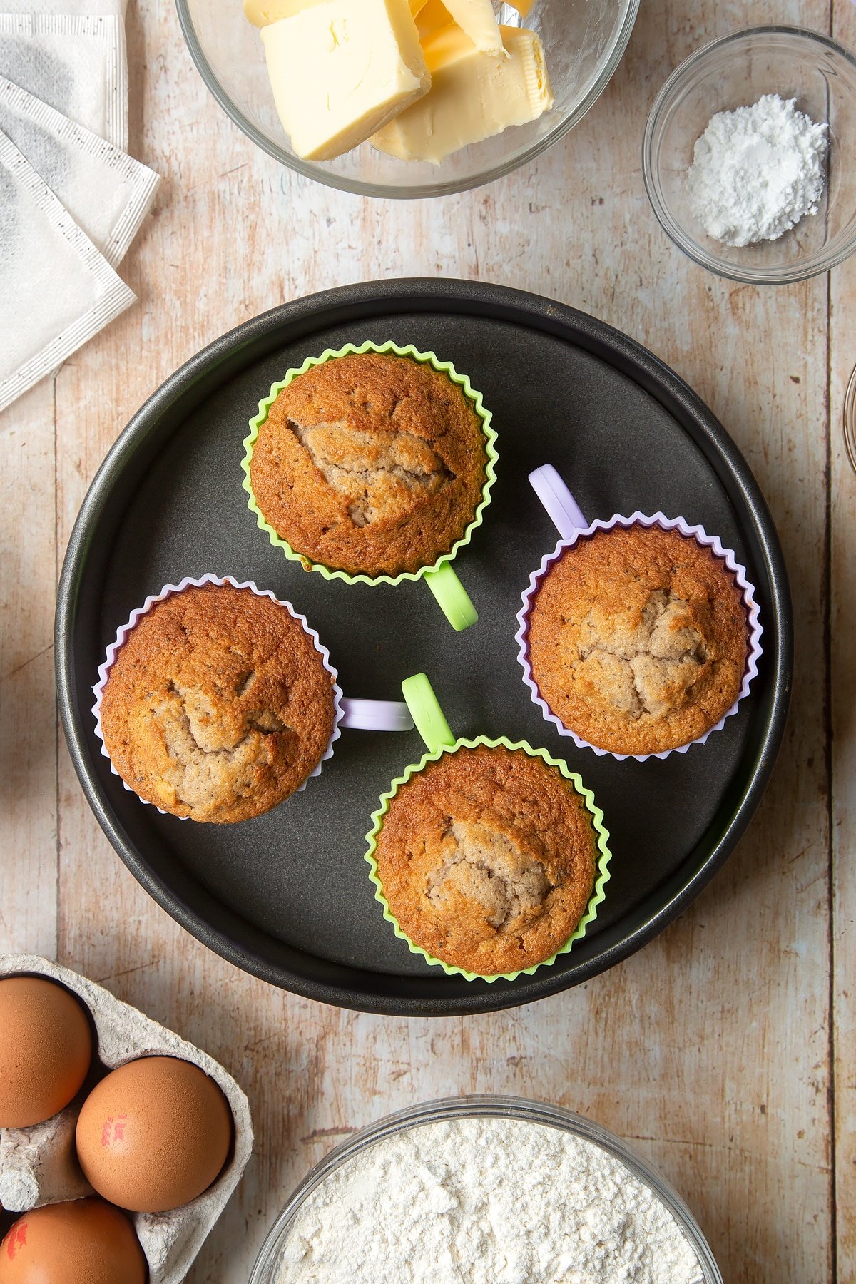 Earl Grey cupcakes inside a cake tin having been in the oven.