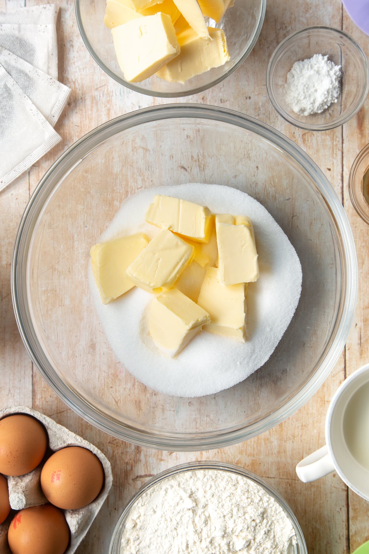 Overhead shot of butter and sugar in a large bowl