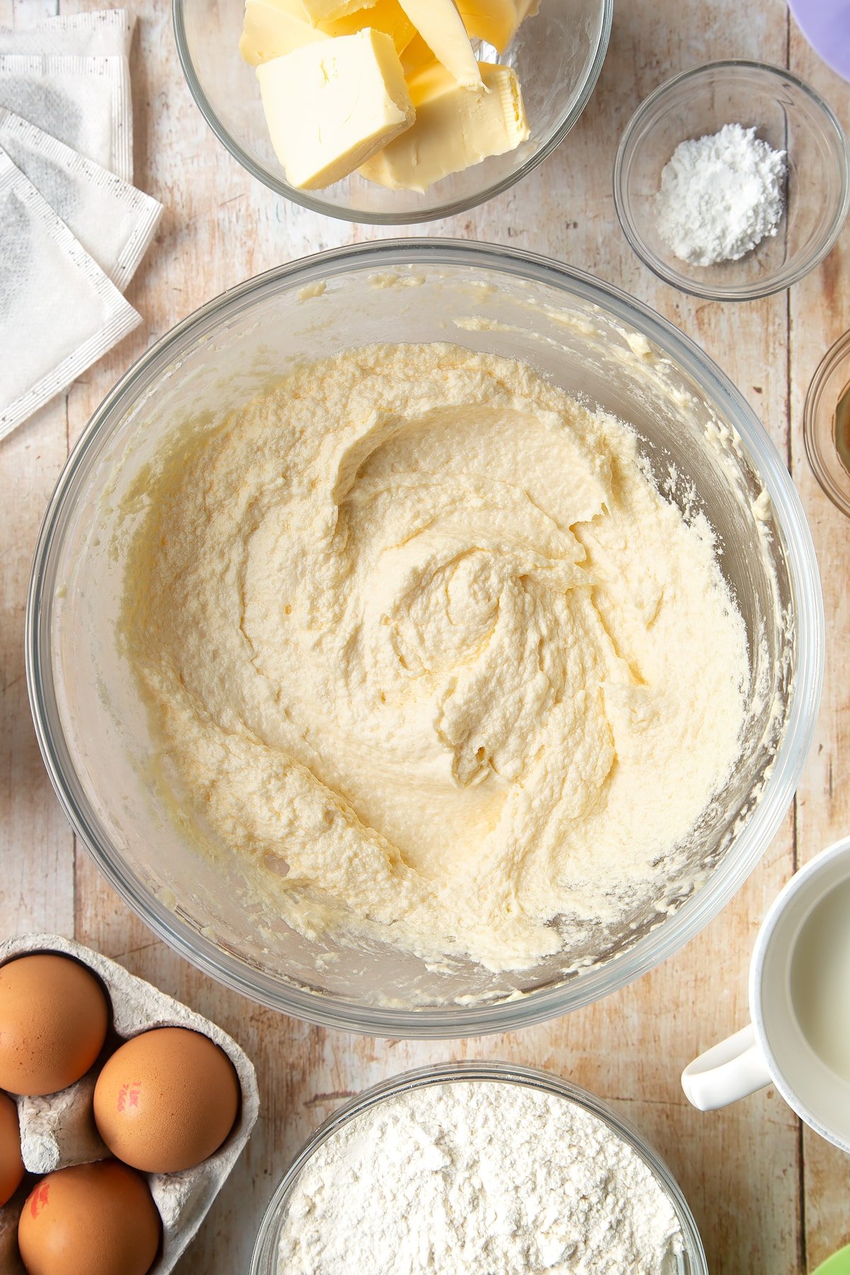 Overhead shot of butter in a large clear bowl