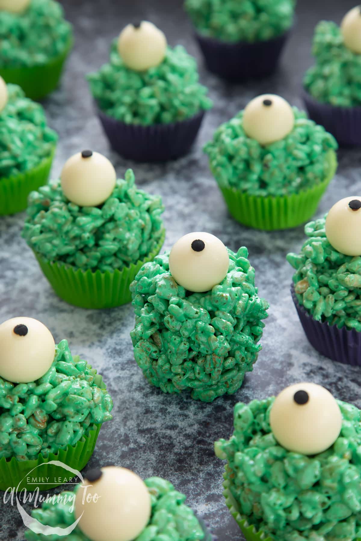 Halloween crispy cakes, died green and decorated with white truffle eyes.