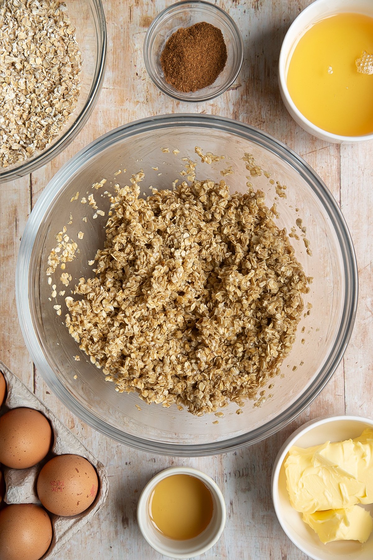 Overhead shot of oats mix in a large clear bowl