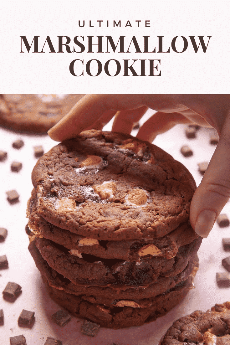 Forward shot of a stack of ultimate marshmallow cookies. At the top of the image there's some text describing the image for Pinterest.