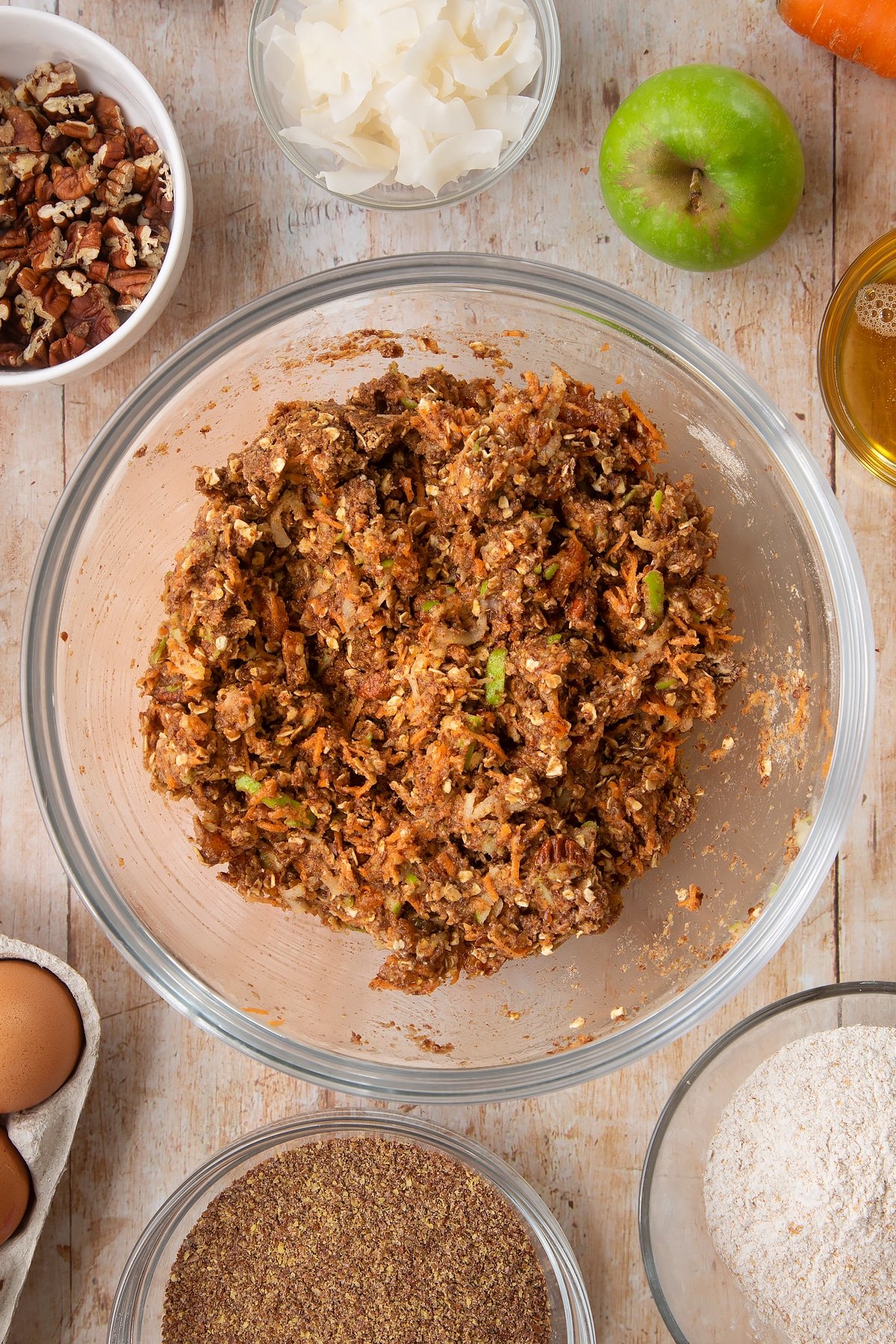 Overhead shot of Superfood breakfast cookie dough in a large clear bowl