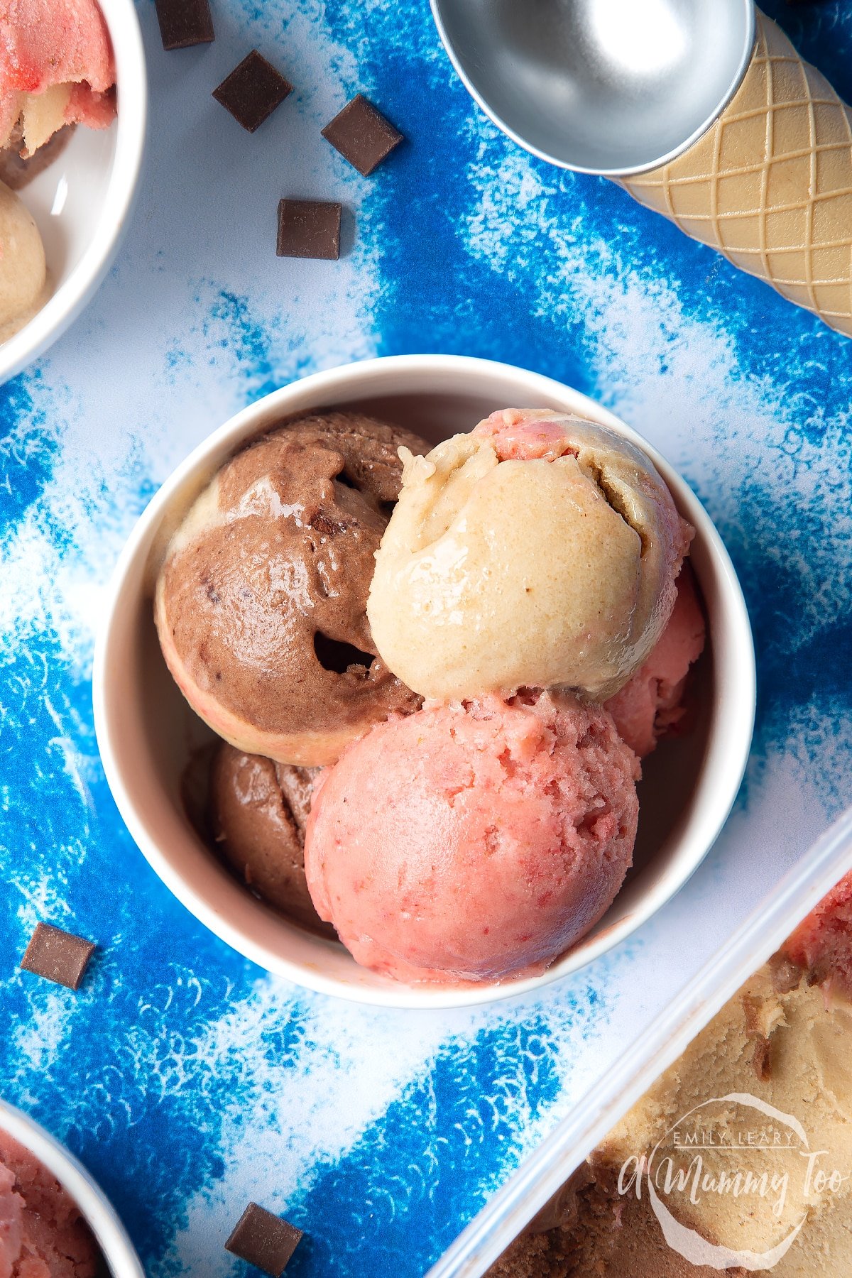 Close up of dairy-free Neapolitan ice cream served in a small white bowl.