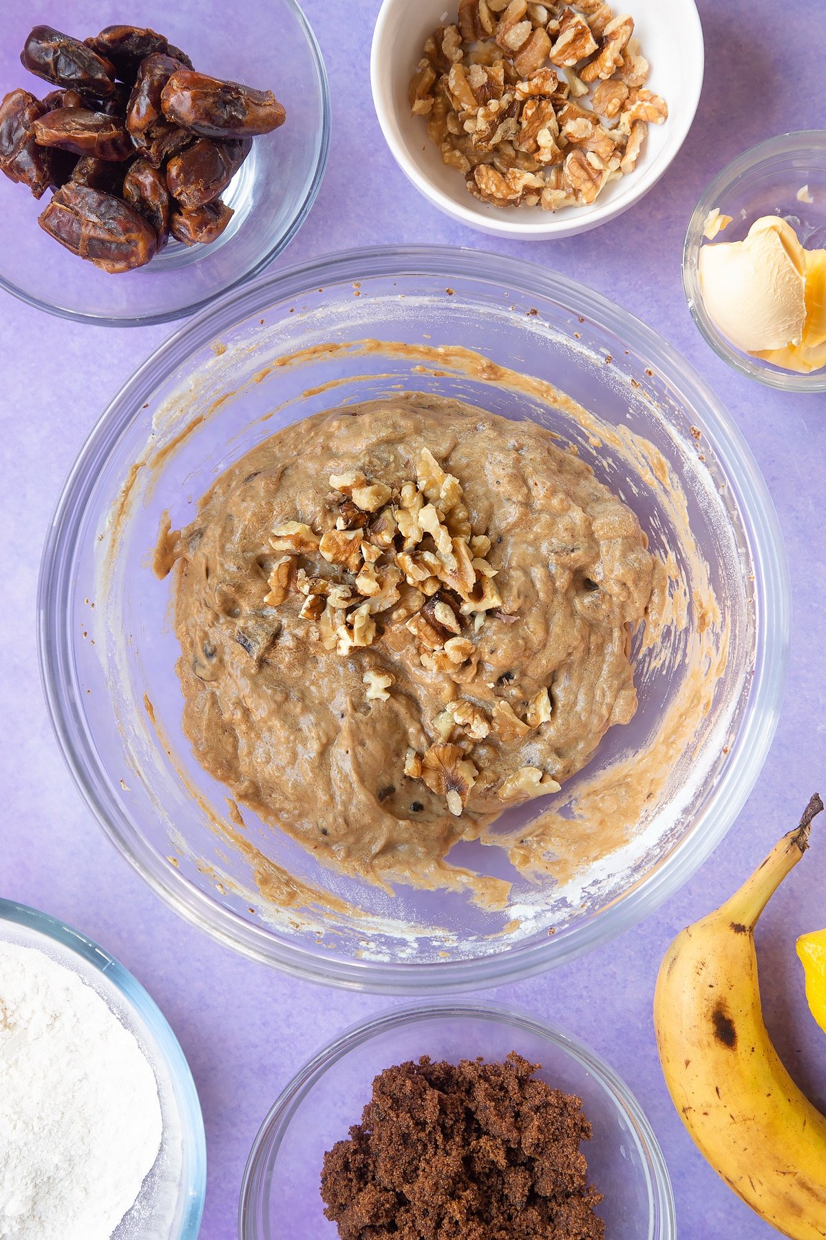 Overhead shot of soaked date mixture and banana mix in a large bowl