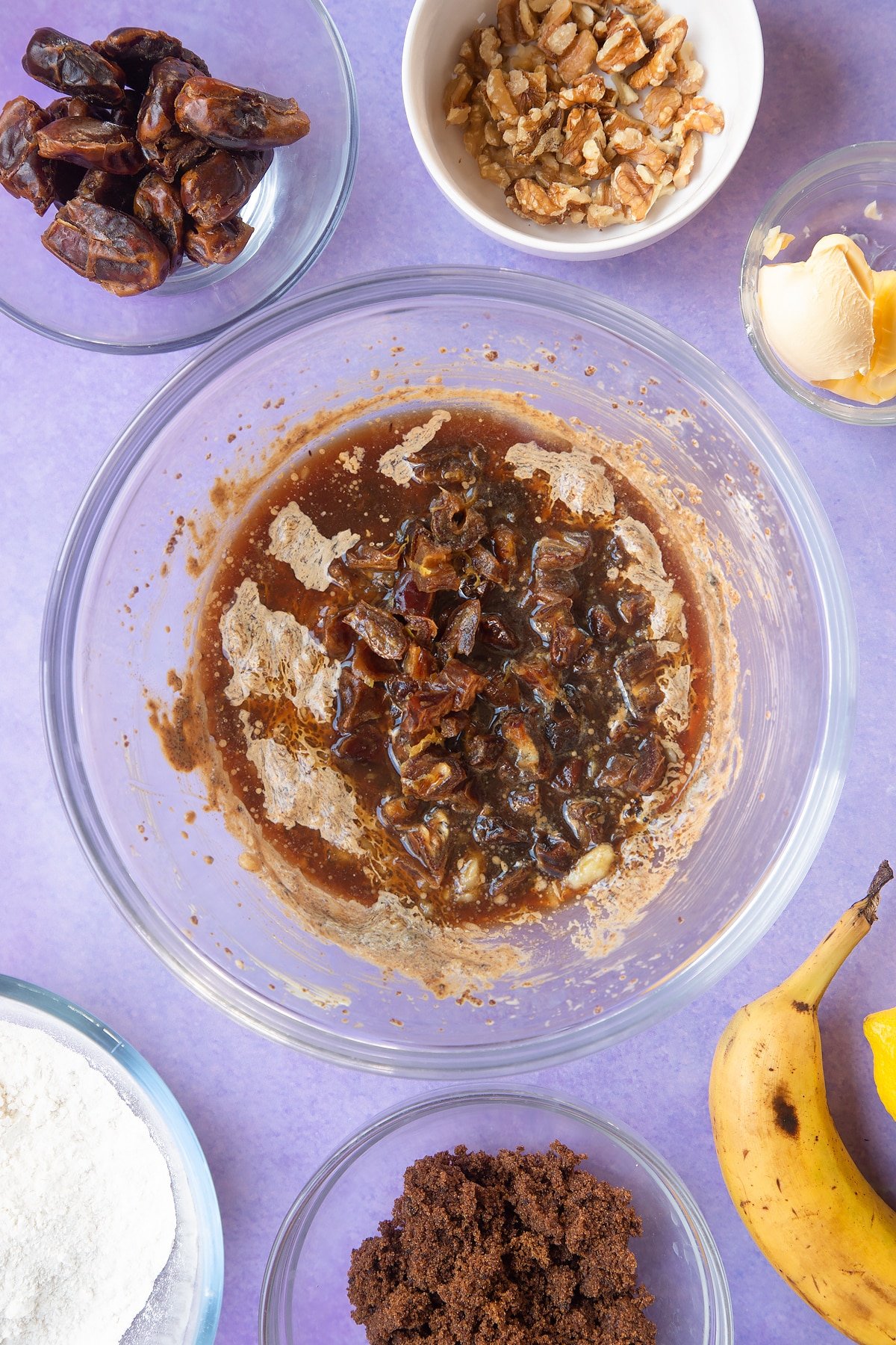 Overhead shot of banana mix in a large clear bowl