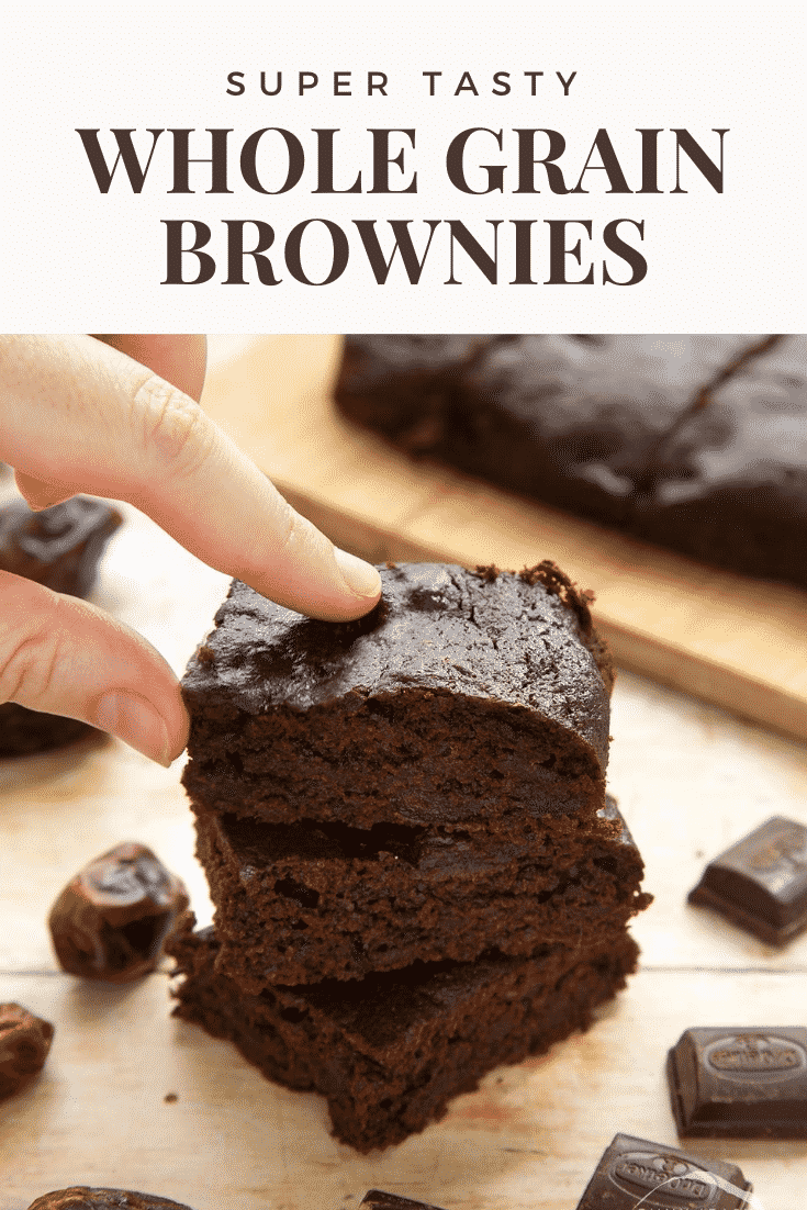 A stack of whole grain brownies made with dates and dark chocolate. A hand reaches to take one. Caption reads: super tasty whole grain brownies