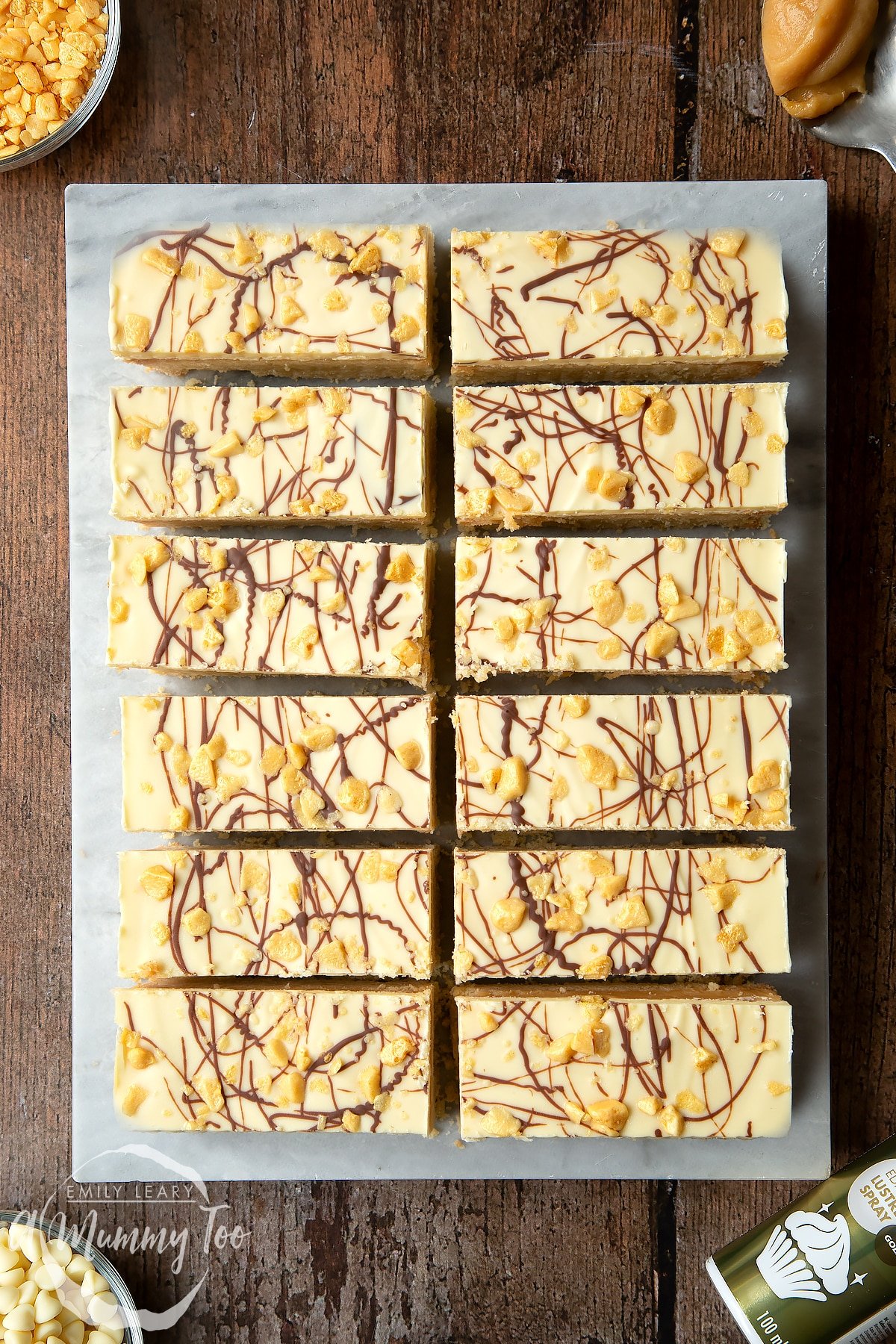 Overhead shot of the sixteen bars on a sheet of baking paper. 