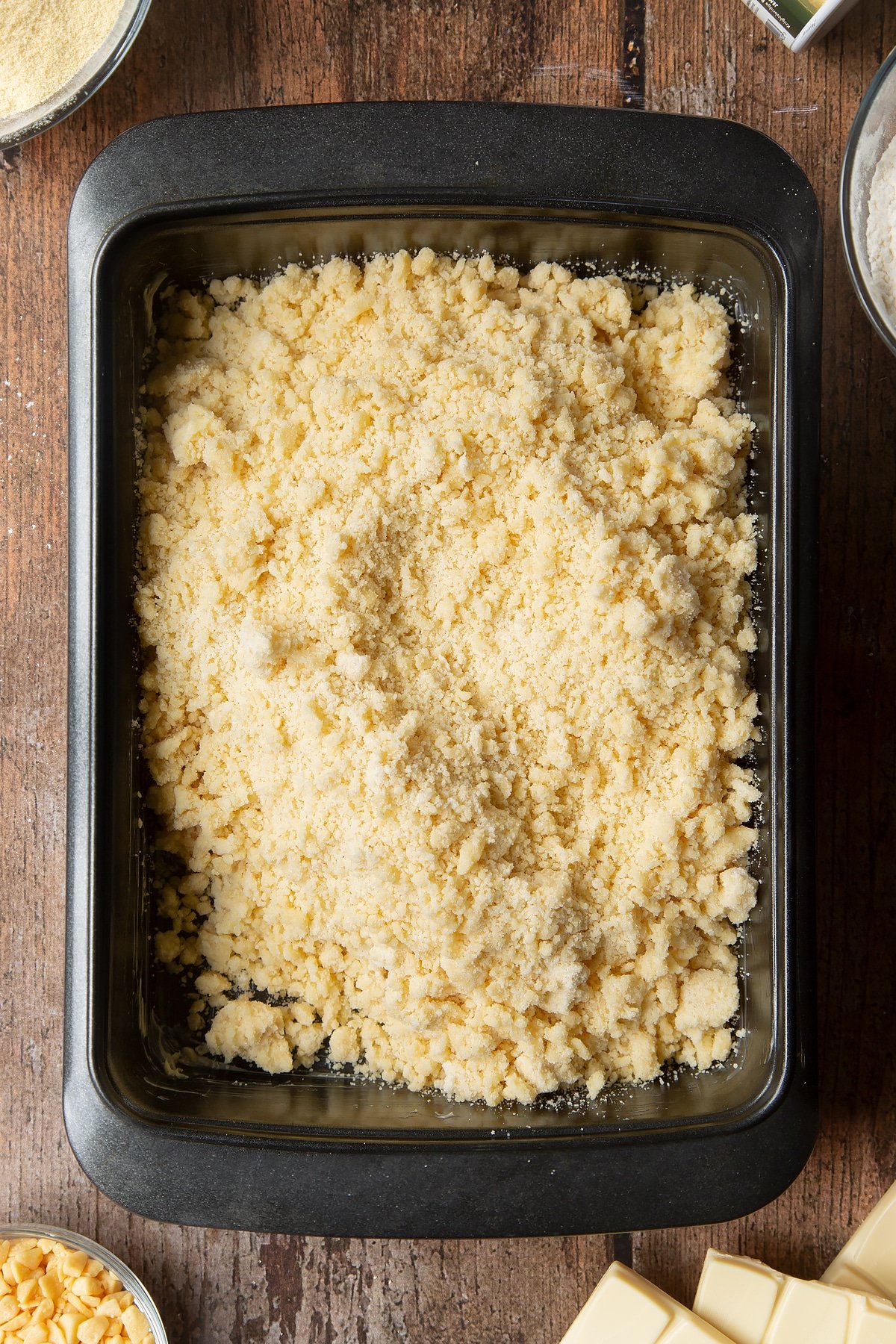 Overhead shot of dough in a well-greased, non-stick, medium roasting tin