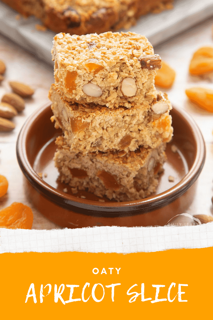 Graphic text APRICOT OAT SLICE EASY AND DELICIOUS above Overhead shot of a hand holding an Apricot oat slice served in a marble slab