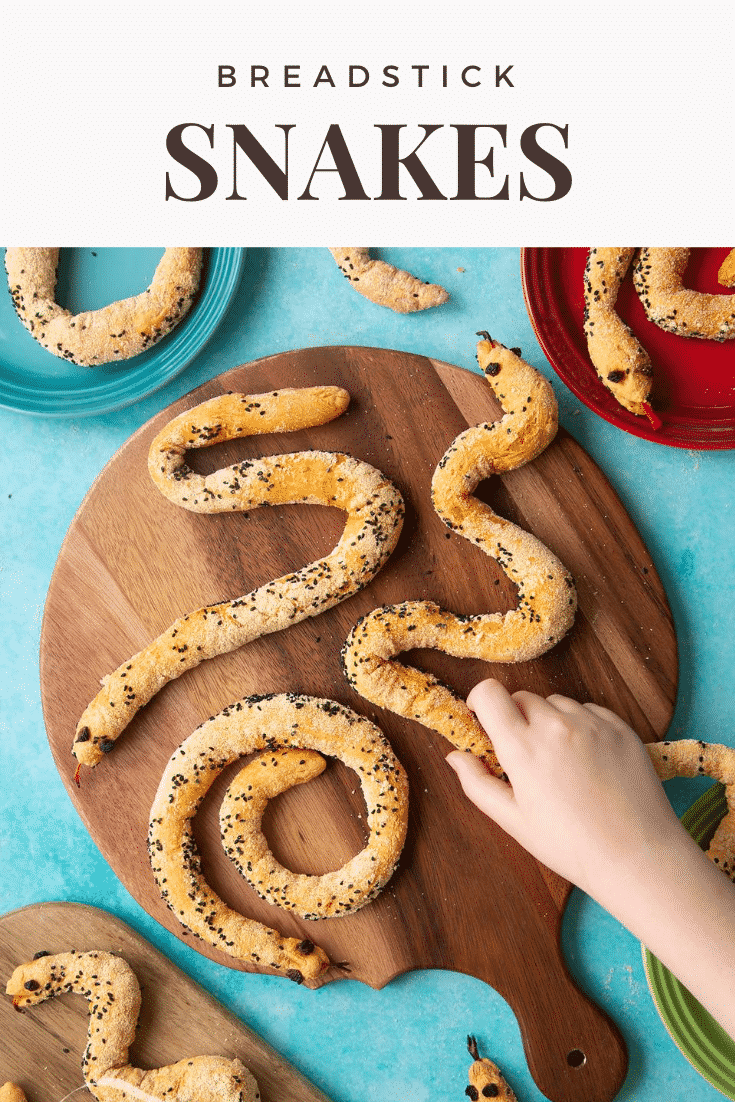 Bread snakes on a wooden board. A hand reaches for one. Caption reads: Breadstick snakes