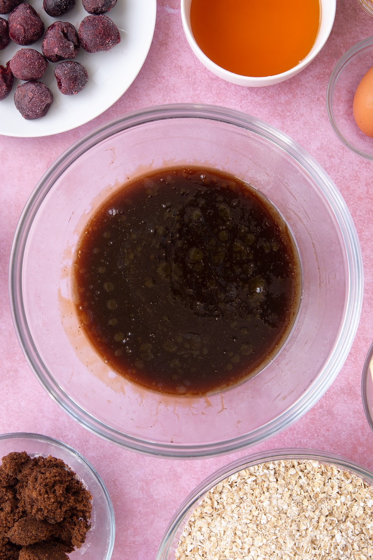 Overhead shot of dark liquid in a large clear bowl