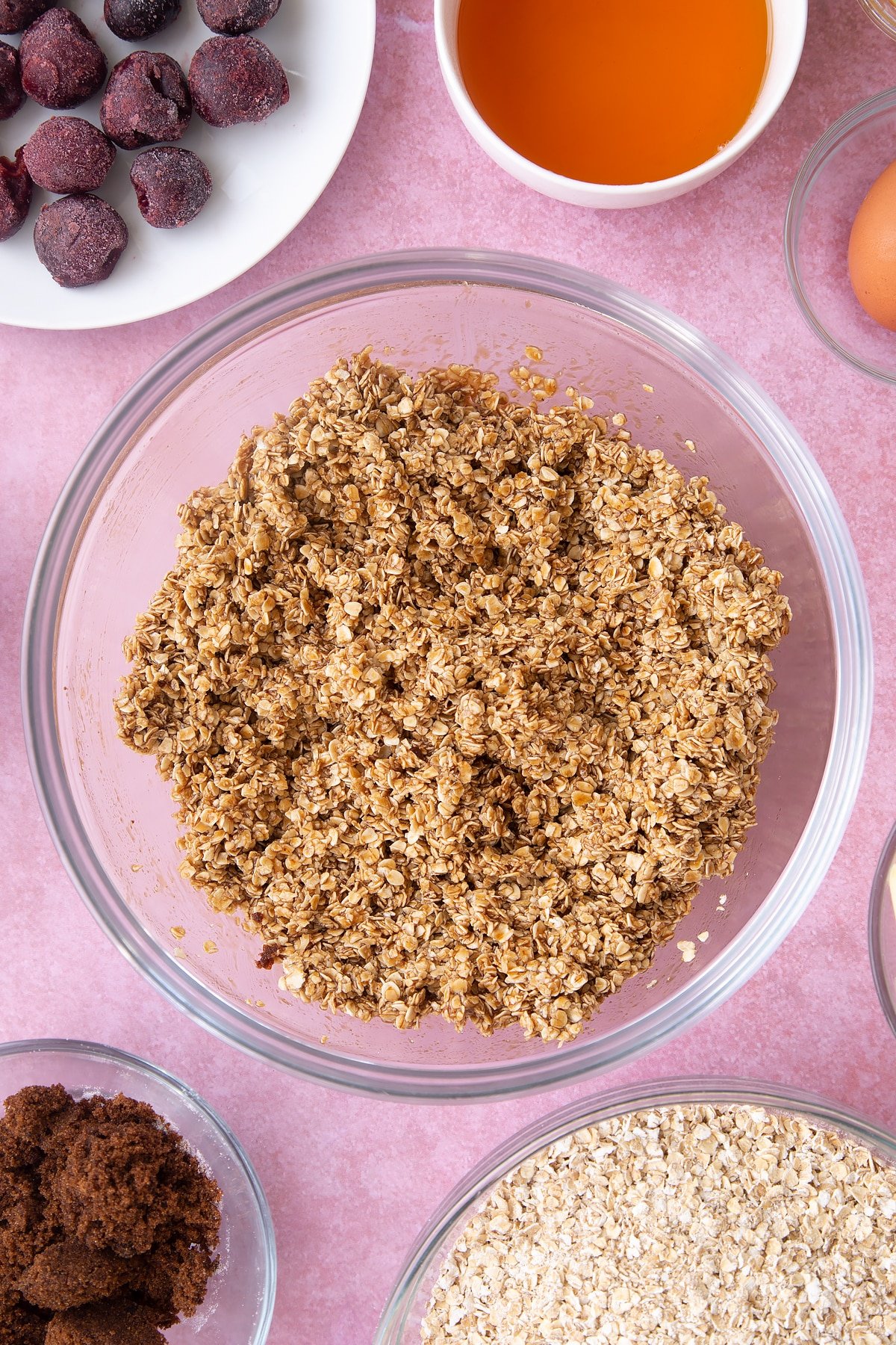 Overhead shot of oats mix in a large clear bowl