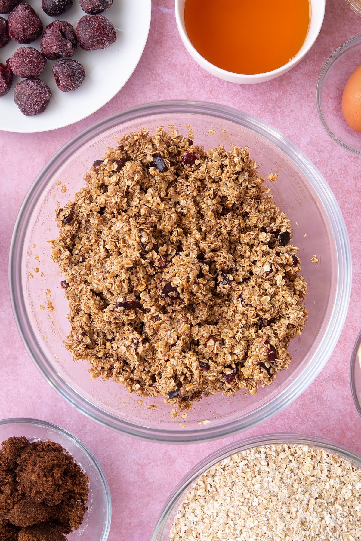 Overhead shot of oats mix in a large clear bowl