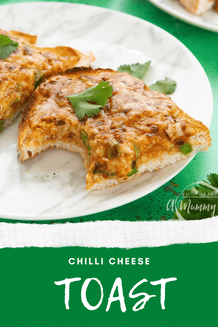 Two pieces of chilli cheese toast on a white marbled plate, scattered with coriander with a bite out of one. Caption reads: chilli cheese toast